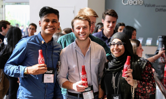 Coca-Cola Scholars holding bottles of Coca-Cola